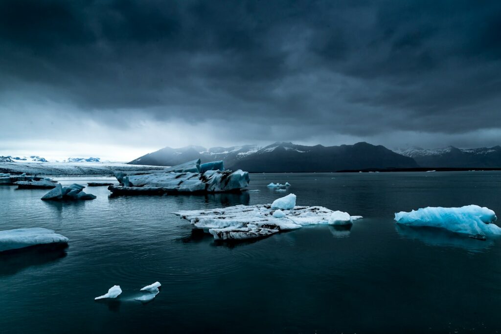glacier near body of water